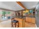 Basement bar with a view to the exterior, seating for two, and a granite countertop at 119 Ward Ct, Lakewood, CO 80228