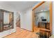 Inviting entryway with hardwood floors, decorative mirror and staircase to the upper level at 119 Ward Ct, Lakewood, CO 80228
