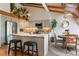 Kitchen with a granite island, stainless steel appliances, pendant lighting, and an adjacent breakfast nook at 119 Ward Ct, Lakewood, CO 80228