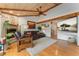 Comfortable living room featuring a fireplace, plush seating, and mounted television at 119 Ward Ct, Lakewood, CO 80228
