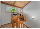 Staircase with a wooden railing leading to an upper level with a display niche and a shuttered window at 119 Ward Ct, Lakewood, CO 80228