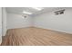 Spacious basement area with wood-look flooring and two windows for natural light at 1844 S Pontiac Way, Denver, CO 80224