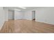 Finished basement featuring wood-look floors, closet, and a doorway at 1844 S Pontiac Way, Denver, CO 80224