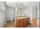 Bathroom vanity offers ample counter space, decorative lighting and classic fixtures at 1844 S Pontiac Way, Denver, CO 80224