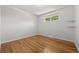 This bedroom features pristine hardwood floors and bright, natural light from the window at 1844 S Pontiac Way, Denver, CO 80224