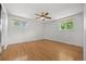 Generous bedroom with hardwood floors, ceiling fan and two windows for ample natural light at 1844 S Pontiac Way, Denver, CO 80224