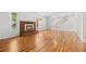 Bright living room with hardwood floors, fireplace, staircase and natural light at 1844 S Pontiac Way, Denver, CO 80224