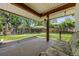 Covered patio with seating and views of the fenced backyard at 1844 S Pontiac Way, Denver, CO 80224