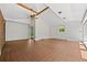 Large sunroom with vaulted ceilings, exposed beams, and tiled floors at 1844 S Pontiac Way, Denver, CO 80224