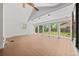 Spacious sun room with natural light and views of the backyard at 1844 S Pontiac Way, Denver, CO 80224