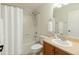 Well-lit bathroom features a shower-tub combo with white tiling and a modern vanity at 1983 Candleglow St, Castle Rock, CO 80109
