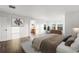 Bedroom with hardwood floors, neutral decor, and a walk-in closet at 1983 Candleglow St, Castle Rock, CO 80109