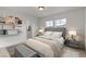 Cozy bedroom with built-in shelving, walk-in closet, plush carpeting, and modern lighting at 1983 Candleglow St, Castle Rock, CO 80109