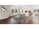 Elegant dining area with modern lighting, hardwood floors, and seamless flow to other living spaces at 1983 Candleglow St, Castle Rock, CO 80109