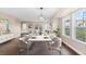 Spacious dining room featuring a modern chandelier, large windows, and a stylish dining set at 1983 Candleglow St, Castle Rock, CO 80109