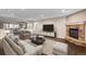 Comfortable living room features recessed lighting, a stone fireplace, and an open layout at 1983 Candleglow St, Castle Rock, CO 80109