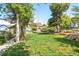 A lush backyard offers mature trees, a grassy lawn, and manicured garden beds at 510 16Th St, Golden, CO 80401