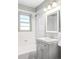 Bathroom with tub/shower combination with white tile, a single sink vanity, and a window at 510 16Th St, Golden, CO 80401
