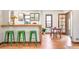Open dining area with hardwood floors, stylish seating and a bar counter at 510 16Th St, Golden, CO 80401
