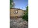 A brick house exterior has a stone patio and several windows looking into the home at 510 16Th St, Golden, CO 80401