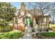 Attractive brick home with a lush lawn, garden beds, and a bright green front door at 510 16Th St, Golden, CO 80401