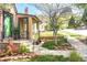 Landscaped front yard featuring a well-maintained lawn, garden beds and stone edging at 510 16Th St, Golden, CO 80401