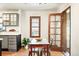 Bright kitchen features a window overlooking the backyard and a door leading to the outdoor patio at 510 16Th St, Golden, CO 80401