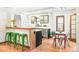 Bright kitchen features a breakfast bar with seating and updated cabinets, hardwood floors, and stainless steel appliances at 510 16Th St, Golden, CO 80401