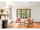 Cozy living room with a decorative fireplace, hardwood floors, and ample natural light at 510 16Th St, Golden, CO 80401