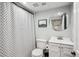 This classic bathroom features a shower/tub combo, toilet, and large mirror at 4190 S Grant St, Englewood, CO 80113