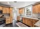Functional kitchen featuring modern appliances, granite countertops, and ample cabinet space at 4190 S Grant St, Englewood, CO 80113