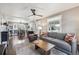 Open-concept living room flows into the dining area, with hardwood floors and lots of natural light at 4190 S Grant St, Englewood, CO 80113