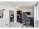 This home office features modern computer equipment and a full length mirror at 4190 S Grant St, Englewood, CO 80113
