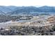 Aerial view of residential neighborhood near mountains and highway at 8946 W Teton Cir, Littleton, CO 80128