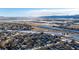 Aerial view of neighborhood near lake and highway at 8946 W Teton Cir, Littleton, CO 80128