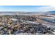 Aerial view of homes near a lake and highway at 8946 W Teton Cir, Littleton, CO 80128