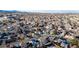 Aerial view showing neighborhood homes, landscaping, and distant mountains at 8946 W Teton Cir, Littleton, CO 80128