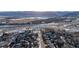 Aerial view of neighborhood near mountains and highway at 8946 W Teton Cir, Littleton, CO 80128