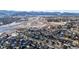 Aerial view of neighborhood near mountains and highway at 8946 W Teton Cir, Littleton, CO 80128