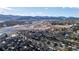 Aerial view of neighborhood near mountains and highway at 8946 W Teton Cir, Littleton, CO 80128