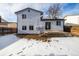 View of the home's back; features a patio and fenced yard at 8946 W Teton Cir, Littleton, CO 80128