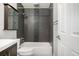 Bathroom with gray tile, a tub, and a vanity at 8946 W Teton Cir, Littleton, CO 80128