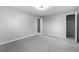 Bedroom with gray walls, carpet, and mirrored closet doors at 8946 W Teton Cir, Littleton, CO 80128