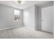 Well-lit bedroom with gray walls and carpet at 8946 W Teton Cir, Littleton, CO 80128