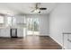 Modern kitchen with white cabinets, stainless steel appliances, and mosaic backsplash at 8946 W Teton Cir, Littleton, CO 80128