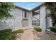 Inviting entrance with stone facade, unique architecture, and a well-maintained walkway at 5751 E Ithaca Pl # 3, Denver, CO 80237