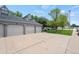 Spacious three-car garage with ample parking and a well-maintained driveway at 5751 E Ithaca Pl # 3, Denver, CO 80237