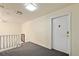 Hallway landing featuring neutral decor and door to apartment at 5751 E Ithaca Pl # 3, Denver, CO 80237