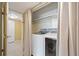 Updated laundry room with newer machines and lighting at 5751 E Ithaca Pl # 3, Denver, CO 80237