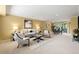 Comfortable living room with neutral carpet, furnishings, and ample lighting at 5751 E Ithaca Pl # 3, Denver, CO 80237